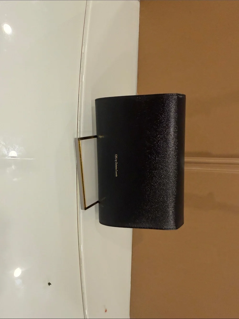 Black Leather Crossbody Bag with Gold Logo Accent